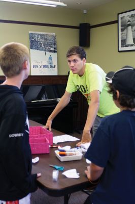 CSI Chemistry
During the CSI Chemistry event at the Mattapoisett Free Library on August 1, Rochester Police Chief Paul Magee fingerprinted the kids during a fingerprinting demonstration, and Brendan Taylor, age 10, was the first one up. Chief Magee’s son Rob Magee led the presentation, which was one of the library’s exciting children’s summer events. Photo by Jean Perry
