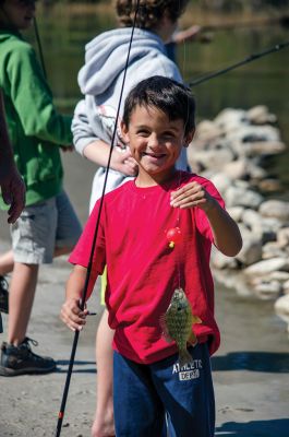 Gine Fishing
Rochester Scout Pack 30 had a fishing day at Five Mile Pond at Camp Cachelot in Myles Standish State Forest on September 27. The Cub Scouts were being trained in the art of fishing, tying knots for their hooks, as well as baiting a hook. Joshua Ernstzen, 7, (middle right) was the first Cub Scout to catch a fish. Photos by Denzil Ernstzen
