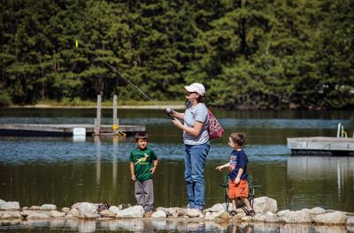 Gine Fishing
Rochester Scout Pack 30 had a fishing day at Five Mile Pond at Camp Cachelot in Myles Standish State Forest on September 27. The Cub Scouts were being trained in the art of fishing, tying knots for their hooks, as well as baiting a hook. Joshua Ernstzen, 7, (middle right) was the first Cub Scout to catch a fish. Photos by Denzil Ernstzen
