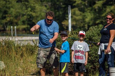 Gine Fishing
Rochester Scout Pack 30 had a fishing day at Five Mile Pond at Camp Cachelot in Myles Standish State Forest on September 27. The Cub Scouts were being trained in the art of fishing, tying knots for their hooks, as well as baiting a hook. Joshua Ernstzen, 7, (middle right) was the first Cub Scout to catch a fish. Photos by Denzil Ernstzen
