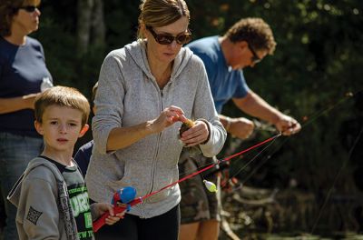 Gine Fishing
Rochester Scout Pack 30 had a fishing day at Five Mile Pond at Camp Cachelot in Myles Standish State Forest on September 27. The Cub Scouts were being trained in the art of fishing, tying knots for their hooks, as well as baiting a hook. Joshua Ernstzen, 7, (middle right) was the first Cub Scout to catch a fish. Photos by Denzil Ernstzen
