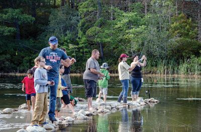 Gine Fishing
Rochester Scout Pack 30 had a fishing day at Five Mile Pond at Camp Cachelot in Myles Standish State Forest on September 27. The Cub Scouts were being trained in the art of fishing, tying knots for their hooks, as well as baiting a hook. Joshua Ernstzen, 7, (middle right) was the first Cub Scout to catch a fish. Photos by Denzil Ernstzen
