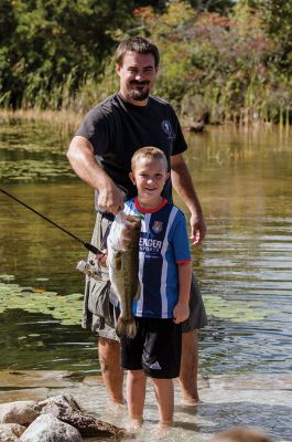 Gine Fishing
Rochester Scout Pack 30 had a fishing day at Five Mile Pond at Camp Cachelot in Myles Standish State Forest on September 27. The Cub Scouts were being trained in the art of fishing, tying knots for their hooks, as well as baiting a hook. Joshua Ernstzen, 7, (middle right) was the first Cub Scout to catch a fish. Photos by Denzil Ernstzen
