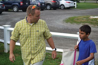 Happy Campers 
What's happening on a Tuesday morning at Camp Massasoit? It’s easier to ask what's not going on – swimming, boating, archery, crafts, exploring, wall climbing, ball playing, and that's all before they even break for lunch. Photos by Jonathan Comey
