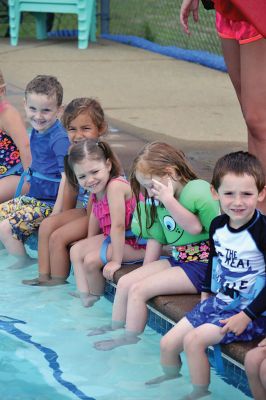 Happy Campers 
What's happening on a Tuesday morning at Camp Massasoit? It’s easier to ask what's not going on – swimming, boating, archery, crafts, exploring, wall climbing, ball playing, and that's all before they even break for lunch. Photos by Jonathan Comey
