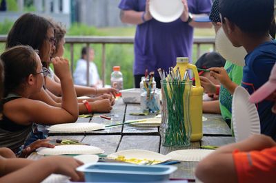 Happy Campers 
What's happening on a Tuesday morning at Camp Massasoit? It’s easier to ask what's not going on – swimming, boating, archery, crafts, exploring, wall climbing, ball playing, and that's all before they even break for lunch. Photos by Jonathan Comey
