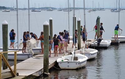 Happy Campers 
What's happening on a Tuesday morning at Camp Massasoit? It’s easier to ask what's not going on – swimming, boating, archery, crafts, exploring, wall climbing, ball playing, and that's all before they even break for lunch. Photos by Jonathan Comey
