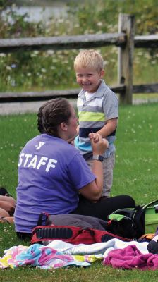 Happy Campers 
What's happening on a Tuesday morning at Camp Massasoit? It’s easier to ask what's not going on – swimming, boating, archery, crafts, exploring, wall climbing, ball playing, and that's all before they even break for lunch. Photos by Jonathan Comey
