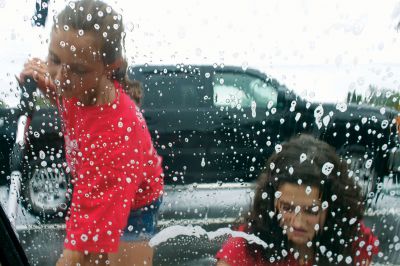 Swim Team Car Wash
Friends of Old Rochester Swimming volunteer and Wareham Riptides swimmer Sophie Johnson, who will be in seventh grade at ORRJHS in the fall, scrubs down a sedan at the group’s car wash fundraiser at the Mattapoisett Fire Department on Saturday, July 28, 2012.  The new swim team at ORRHS needs to raise $7,500 by October in order to secure a coach and pool facilities.  Photo by Eric Tripoli.  
