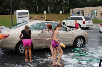 Sippican Elementary Car Wash
Sippican Elementary sixth graders turned Saturday's car wash into a fire engine wash, creating a waterfall of suds and having the kind of fun kids normally associate with what happens on the weekends before school is back in session. Organized by Volunteers at Sippican Elementary (VASE), the school's 501(c)(3) non-profit parent-teacher organization, the event held at the Marion school's bus loop off Main Street raised money for the students' mountain classroom trip, a three-day excursion planned for June 20
