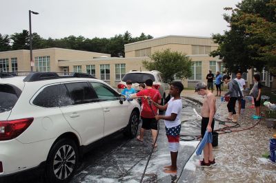 Sippican Elementary Car Wash
Sippican Elementary sixth graders turned Saturday's car wash into a fire engine wash, creating a waterfall of suds and having the kind of fun kids normally associate with what happens on the weekends before school is back in session. Organized by Volunteers at Sippican Elementary (VASE), the school's 501(c)(3) non-profit parent-teacher organization, the event held at the Marion school's bus loop off Main Street raised money for the students' mountain classroom trip, a three-day excursion planned for June 20
