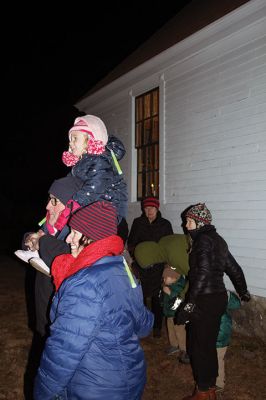 Tinkhamtown Chapel Christmas Carol Singalong
Sunday's participants in the Tinkhamtown Chapel Christmas Carol Singalong braved a dramatic, postsunset drop in temperature and enjoyed the warmth of a solo bonfire loaned to the event by Lee Heald. Gail Roberts led distributed sheet music and led in song with musicians Louise Anthony playing the fiddle and Jack Dean the ukulele. Roberts thanked the White family for providing refreshments, the Chapel committee for its effort in maintaining the chapel 
