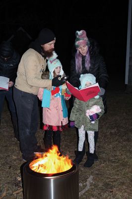 Tinkhamtown Chapel Christmas Carol Singalong
Sunday's participants in the Tinkhamtown Chapel Christmas Carol Singalong braved a dramatic, postsunset drop in temperature and enjoyed the warmth of a solo bonfire loaned to the event by Lee Heald. Gail Roberts led distributed sheet music and led in song with musicians Louise Anthony playing the fiddle and Jack Dean the ukulele. Roberts thanked the White family for providing refreshments, the Chapel committee for its effort in maintaining the chapel 
