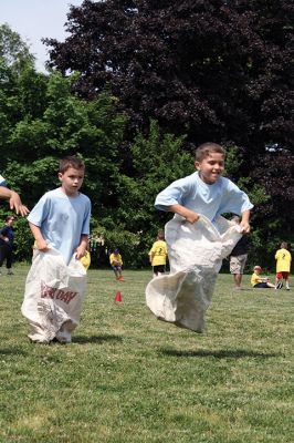 Center School Field Day
It turned out to be a gorgeous day on Tuesday, June 7, for the annual Center School Field Day activities. Relay races, hula hoops, cup stacking, parachute tossing, and even bubble-blowing kept the students busy and active across the school grounds in a constant whirlwind of motion and color. Photos by Jean Perry
