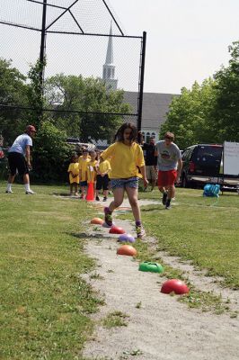 Center School Field Day
It turned out to be a gorgeous day on Tuesday, June 7, for the annual Center School Field Day activities. Relay races, hula hoops, cup stacking, parachute tossing, and even bubble-blowing kept the students busy and active across the school grounds in a constant whirlwind of motion and color. Photos by Jean Perry
