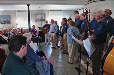 Chanty 8004
The Mattapoisett Museum and Carriage House hosted The New Bedford Sea Chantey Chorus on Sunday afternoon, April 29. The matinee concert featuring a variety of ballads, folk songs and work songs - or chanteys - was played before a full house as patrons filled the old church house to the rafters. Photo by Robert Chiarito
