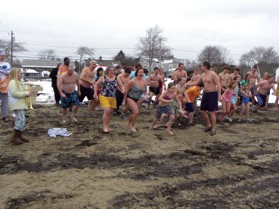 Christmas Swim
A 2009 Christmas morning swim benefitted Helping Hands and Hooves, a Mattapoisett non-profit organization dedicated to therapeutic horseback riding for adults with disabilities. 40 swimmers and at least 50 onlookers participated in the 2009 swim. All of the proceeds from the event went to Helping Hands and Hooves. Photo courtesy of Debbi Dyson.
