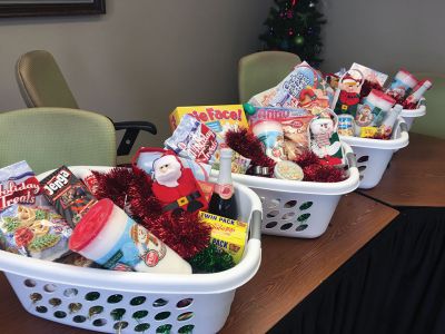 Christmas Baskets
On Tuesday, December 20, Rochester Facilities Manager Andrew Daniel was tying perfect Christmas bows to top off gift baskets for Rochester families purchased with donations from Town Hall staff and town boards and committees. Four families this year will receive a Christmas meal in a basket thanks to the efforts of all at Town Hall. Altogether $1,400 was raised at Town Hall, with half going to the gift baskets and the other half towards other town Christmas charities. Photos by Jean Perry
