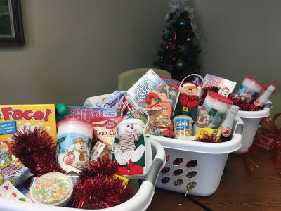 Christmas Baskets
On Tuesday, December 20, Rochester Facilities Manager Andrew Daniel was tying perfect Christmas bows to top off gift baskets for Rochester families purchased with donations from Town Hall staff and town boards and committees. Four families this year will receive a Christmas meal in a basket thanks to the efforts of all at Town Hall. Altogether $1,400 was raised at Town Hall, with half going to the gift baskets and the other half towards other town Christmas charities. Photos by Jean Perry
