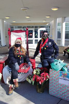 Fill-A-Cruiser Toy Drive
Sunday’s Fill-A-Cruiser toy drive at Sippican Elementary School was a success! Volunteers representing the Marion Police Department, Police Brotherhood, and Sippican School (VASE) welcomed a parade of vehicles of families dropping off a variety of Christmas gifts for cookies and cupcakes. Marion Police Chief John Garcia donned the Santa suit and took pictures with kids in school resource officer Matt McGraw’s 1924 Ford Model-T. Photos by Mick Colageo
