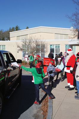 Fill-A-Cruiser Toy Drive
Sunday’s Fill-A-Cruiser toy drive at Sippican Elementary School was a success! Volunteers representing the Marion Police Department, Police Brotherhood, and Sippican School (VASE) welcomed a parade of vehicles of families dropping off a variety of Christmas gifts for cookies and cupcakes. Marion Police Chief John Garcia donned the Santa suit and took pictures with kids in school resource officer Matt McGraw’s 1924 Ford Model-T. Photos by Mick Colageo
