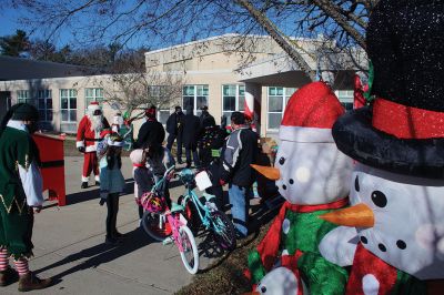 Fill-A-Cruiser Toy Drive
Sunday’s Fill-A-Cruiser toy drive at Sippican Elementary School was a success! Volunteers representing the Marion Police Department, Police Brotherhood, and Sippican School (VASE) welcomed a parade of vehicles of families dropping off a variety of Christmas gifts for cookies and cupcakes. Marion Police Chief John Garcia donned the Santa suit and took pictures with kids in school resource officer Matt McGraw’s 1924 Ford Model-T. Photos by Mick Colageo
