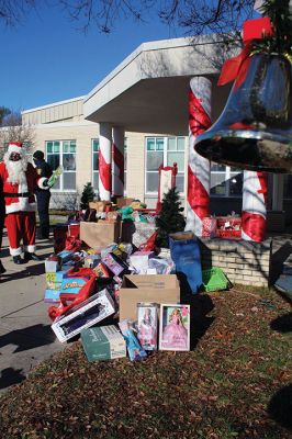 Fill-A-Cruiser Toy Drive
Sunday’s Fill-A-Cruiser toy drive at Sippican Elementary School was a success! Volunteers representing the Marion Police Department, Police Brotherhood, and Sippican School (VASE) welcomed a parade of vehicles of families dropping off a variety of Christmas gifts for cookies and cupcakes. Marion Police Chief John Garcia donned the Santa suit and took pictures with kids in school resource officer Matt McGraw’s 1924 Ford Model-T. Photos by Mick Colageo
