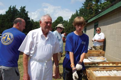 The Big Bake
Michael Lamoureux of the American Legion Florence Eastman Post 220 called the August 8, 2010 clambake a gigantic success. Close to 240 people came to enjoy an old-fashioned clambake with the Lions Club, the Mattapoisett Boy Scout Troop 53, Mattapoisett firefighters, and the Firefighters Auxiliary Club all pitching in to help. Photos by Lynn Short.
