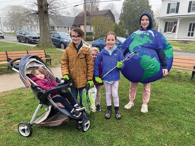 Mattapoisett Sustainability Partnership
The Mattapoisett Sustainability Partnership celebrated Earth Day with a hearty troupe of local citizens, who cleaned up the town despite the raw weather on Saturday. The Lucci family, including dad Rob and children (pictured with "Mother Earth" Phoebe VanInwegen of Marion) Brooke, Philip, Georgia and Violet in the stroller, pitched in from the post office on Route 6 and back down to Water Street. Photo by Susan Pizzolato
