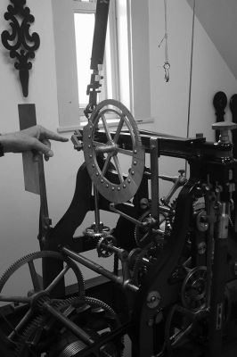 Center School Clock
Behind the clock that faces all four directions at Center School are three levels of mechanics that make the hands move, the bell ring and the machine operate. The clock serves as an in-house museum for schoolchildren to learn about how things worked before the digital age. Photos by Mick Colageo
