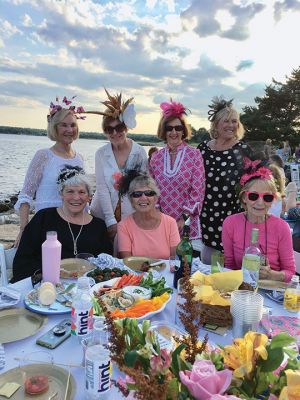 Great Community Picnic
The Great Community Picnic hosted by the Mattapoisett Land Trust and Historical Museum featured great food, music, and lots of creative expression. One table was tricked out in a Jaws theme while another was filled with ladies wearing hats called “fascinators”. The fourth annual fundraiser was a sold out event. The grounds of the MLT’s Munro Preserve provided the perfect location as nearly 200 people mingled harbor side. Photo by Marilou Newell
