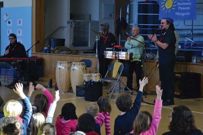 Manguito
Center School students were introduced to Latin rhythms and percussion instruments by the Boston-based educational Latin American music group Manguito during an afternoon presentation on January 24. Manguito members really captured the attention of the kids, resulting in plenty of learning while the group’s sizzling salsa and merengue music resulted in an eruption of dancing and spontaneous conga lines. Photo by Jean Perry
