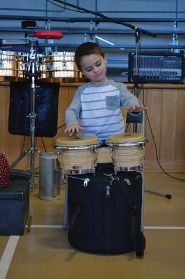 Manguito
Center School students were introduced to Latin rhythms and percussion instruments by the Boston-based educational Latin American music group Manguito during an afternoon presentation on January 24. Manguito members really captured the attention of the kids, resulting in plenty of learning while the group’s sizzling salsa and merengue music resulted in an eruption of dancing and spontaneous conga lines. Photo by Jean Perry
