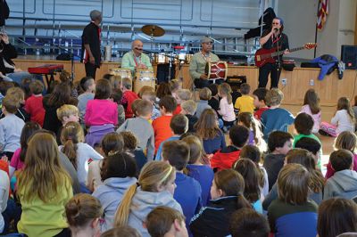 Manguito
Center School students were introduced to Latin rhythms and percussion instruments by the Boston-based educational Latin American music group Manguito during an afternoon presentation on January 24. Manguito members really captured the attention of the kids, resulting in plenty of learning while the group’s sizzling salsa and merengue music resulted in an eruption of dancing and spontaneous conga lines. Photo by Jean Perry
