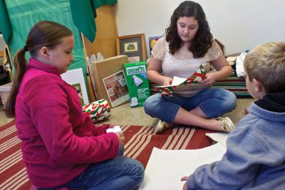 Cranbery Christmas 
At the Rochester Women's Guild Cranberry Christmas, kids were encouraged to shop for small, inexpensive and personal gifts for loved ones in the youth room.  Members of the youth group then helped the kids wrap their special gifts.  From left: Tiana Daniel, Haleydawn Amato, and Jacob Demers.  Photo by Eric Tripoli.
