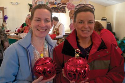 Cranbery Christmas 
Friends Lianne Mcleod (left) and Charlene Duval (right) show off their matching holiday ornament cookie jars, which they found at the Rochester Women's Guild Cranberry Christmas celebration and bazaar on November 10, 2012.  Photo by Eric Tripoli.
