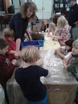 Cranberry Program
On Wednesday, Nov. 20th, he Marion Natural History Museum after-school group investigated how a cranberry bog formed in New England.  Museum Director, Elizabeth Leidhold, helped the kids to explore the physical structure of a bog, and how to tell a healthy berry from a rotten one.  The students then made “mini-bogs” to take home. Photo courtesy Elizabeth Leidhold
