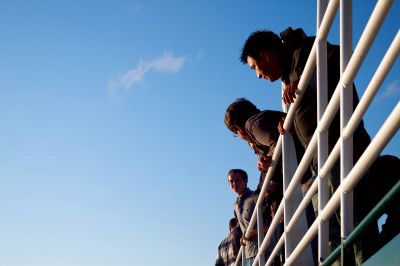 Phoenix Crew Club
Members of the Phoenix Crew team look out over the railing during their first harbor tour fundraiser on Saturday, September 22, 2012.  The rowing team, which was established in April, includes members from the Tri-Town and surrounding area.  Photo by Eric Tripoli.
