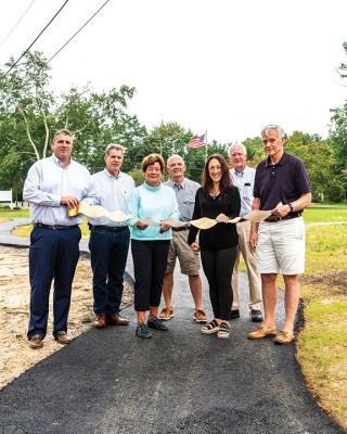 Marion Council on Aging
Merry Conway, president of the Friends of the Marion Council on Aging, cuts the ribbon officially opening the new Walking Path at the Cushing Community Center on September 24. From left: Town Administrator Jay McGrail, Select Board member Randy Parker, Merry Conway, COA Chair Harry Norweb, Administrative Assistant Donna Hemphill, Select Board Chair Norm Hills, and Community Preservation Committee Chair Jeff Doubrava. Photos by Ryan Feeney
