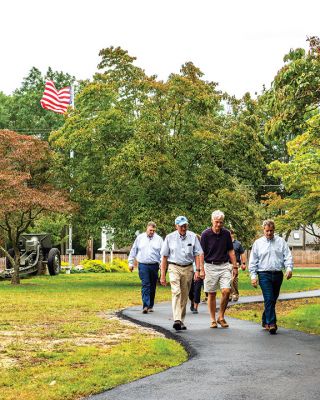 Marion Council on Aging
Merry Conway, president of the Friends of the Marion Council on Aging, cuts the ribbon officially opening the new Walking Path at the Cushing Community Center on September 24. From left: Town Administrator Jay McGrail, Select Board member Randy Parker, Merry Conway, COA Chair Harry Norweb, Administrative Assistant Donna Hemphill, Select Board Chair Norm Hills, and Community Preservation Committee Chair Jeff Doubrava. Photos by Ryan Feeney
