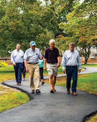 Marion Council on Aging
Merry Conway, president of the Friends of the Marion Council on Aging, cuts the ribbon officially opening the new Walking Path at the Cushing Community Center on September 24. From left: Town Administrator Jay McGrail, Select Board member Randy Parker, Merry Conway, COA Chair Harry Norweb, Administrative Assistant Donna Hemphill, Select Board Chair Norm Hills, and Community Preservation Committee Chair Jeff Doubrava. Photos by Ryan Feeney
