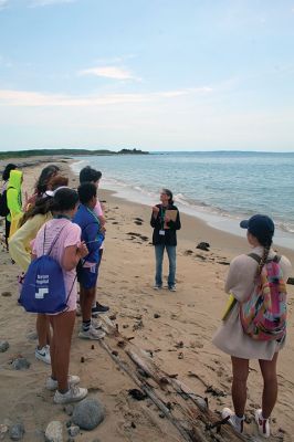 Cuttyhunk
Wendy Copps conducted an “Ocean in Motion” exercise at Barges Beach, and Kate Armstrong led children in an exploration of the saltmarsh as part of Old Hammondtown Elementary School’s field trip to Cuttyhunk on June 16. Approximately 70 Grade 6 graduates made the ferry ride from Mattapoisett to take part in a science field trip organized by the Mattapoisett Land Trust Education Committee and held in conjunction with the Massachusetts Cultural Council and the STEAM Academy. Photos by Mick Colageo
