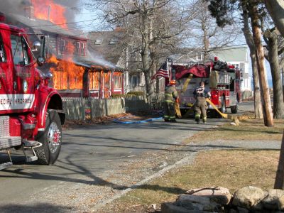 Fatal Fire
A devastating house fire at 13 Briar Road in the Point Connett area of Mattapoisett claimed the life of the sole occupant, 72-year-old Carlton Cook, on Sunday afternoon, February 3. (Photo by Paul Lopes).
