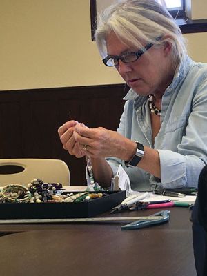 Robin Ragle-Davis
Artisan and jewelry maker Robin Ragle-Davis presented the finer points of jewelry-making with pearls, beads, and shells at the Mattapoisett Public Library on November 2. Participants learned how to assemble materials with the proper use of tools. Ragle-Davis is a graduate of RISD and has been making jewelry for several decades. Photos by Marilou Newell
