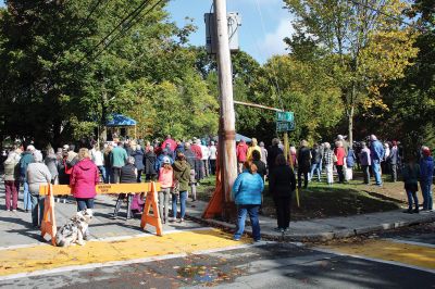 Elizabeth Taber Statue
A murky morning gave way to a sun-drenched celebration of Elizabeth Taber as the bronze statue of “Marion’s Fairy Godmother” was officially unveiled on October 17 in Bicentennial Park. Representatives from the Celebrate Elizabeth Taber Committee, Town of Marion officials, and sculptor Erik Durant addressed a large gathering of citizens who collected stickers and enjoyed music by the Academy Brass Quartet along with cupcakes. See story by Marilou Newell. Photo by Ryan Feeney
