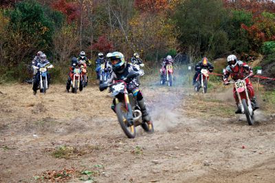 Plymouth Sands Trail Riders 
On Sunday, October 28, the Plymouth Sands Trail Riders bike club held a hare scramble at the Mattapoisett landfill.  The club, which boasts over 300 members from all around New England, had over 100 riders participate in the event.  Riders from teens up to seniors took off for the 40 minute races around the 2.5 mile wooded track.  Proceeds from the event will be part of an annual donation the club makes to fund cystic fibrosis research. Photo by Eric Tripoli
