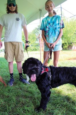 Dog Walk Fundraiser
Freemin Bauer with his five-year-old sibling bulldogs Mia and Louie during Saturday’s dog walk fundraiser held at Center School in Mattapoisett. Six years ago, Bauer was an eagle scout who donated his first dog-walking fundraising collection to an animal shelter in Fairhaven. Approximately 20 dogs were on hand for the August 28 event, a small step in a larger effort to finance a dog park in town. According to Mattapoisett Select Board member Jodi Bauer
