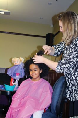 Doll Spa
The Mattapoisett Library treated area kids and their dolls to a spa day on Friday, January 15. With a day off from school, girls had their hair styled by Holly Coutinho, had their nails done by Junior Friend Alice DeCicco-Carey, 11, and decorated hair clips with Junior Friend Nicole Londergan. Photos by Jean Perry
