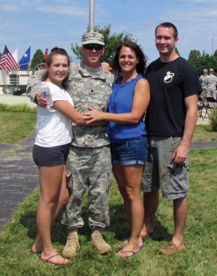 Deploying for Afghanistan
Edward Sweeney Jr. of Rochester hugs his wife Cheryl and children Michael and Alexis before deploying for Afghanistan on Sunday, September 2 from Camp Edwards.  Photo Courtesy of Cheryl Sweeney
