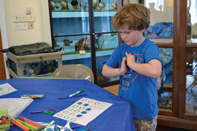 Marion Natural History Museum 
The Marion Natural History Museum hosted their very first Earth Day Celebration on April 19, providing little ones with activities that focused on our planet and stimulated their senses. There was a make your own planet earth pinwheel table, a station to decorate your own “Earth cookie” with green and blue icing, a puppet show stage, and a boat load of Legos to play with while the sounds of croaking frogs and crickets played in the background. Photo by Jean Perry
